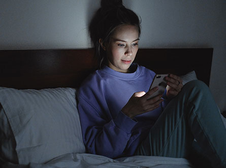 woman looking at smartphone